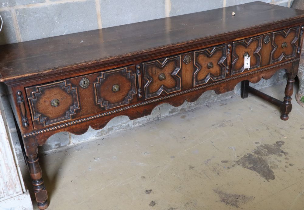 A late 17th century style oak dresser base fitted three geometrically moulded frieze drawers, width 182cm depth 48cm height 75cm